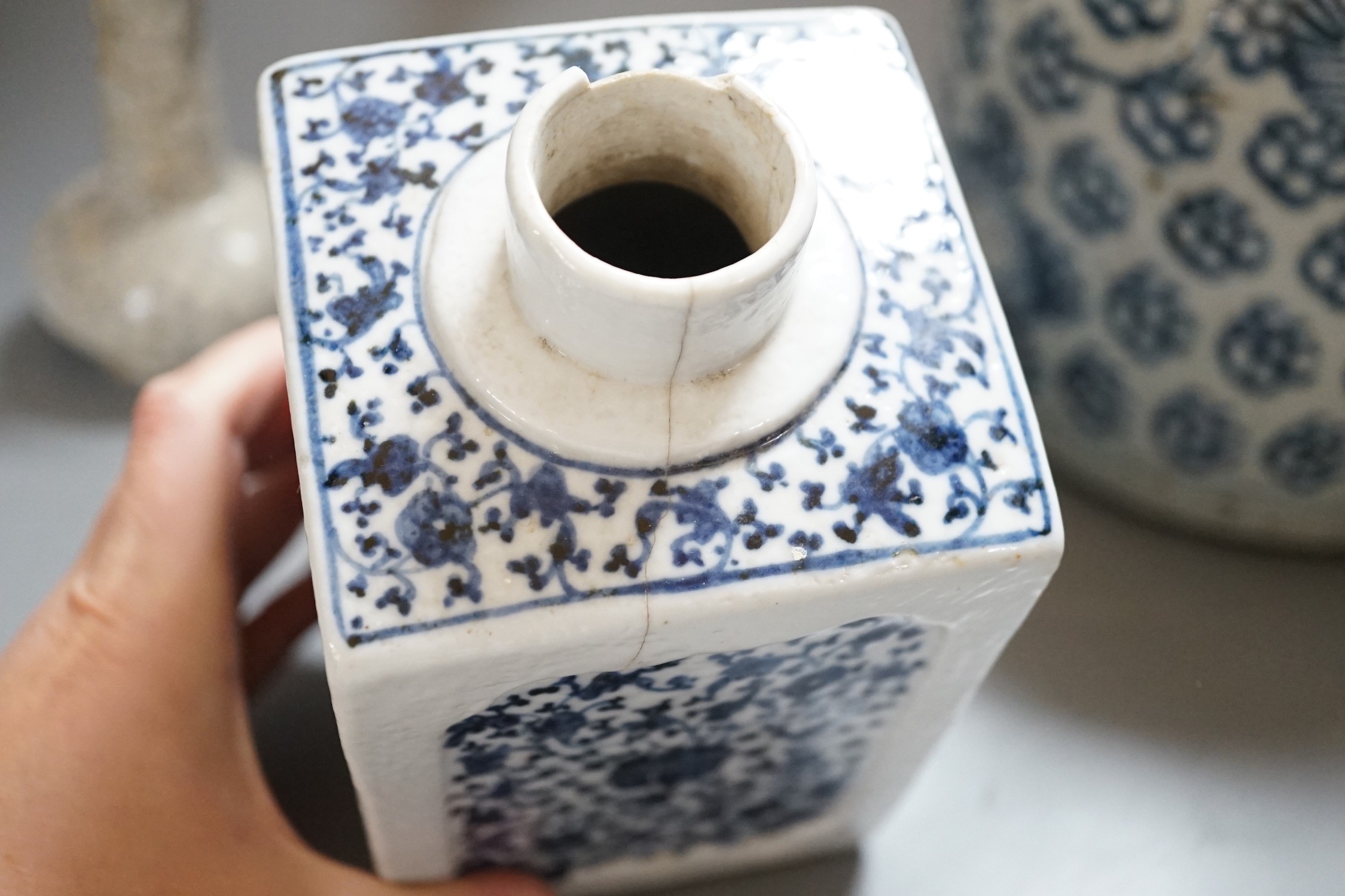 An 18th century Chinese provincial jar together with a tea canister and crackleglaze vase, tallest 18.5cm